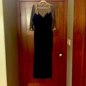 This dress is from Xscape. Formal and a beautiful navy blue with gold accents.